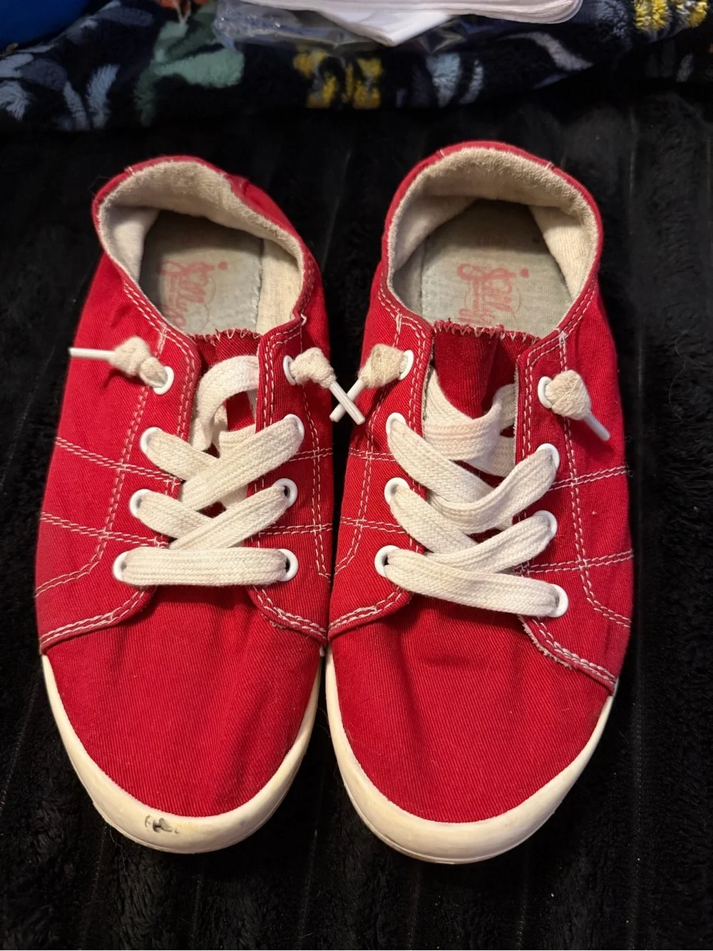 Red canvas sneakers with white stitching size 8